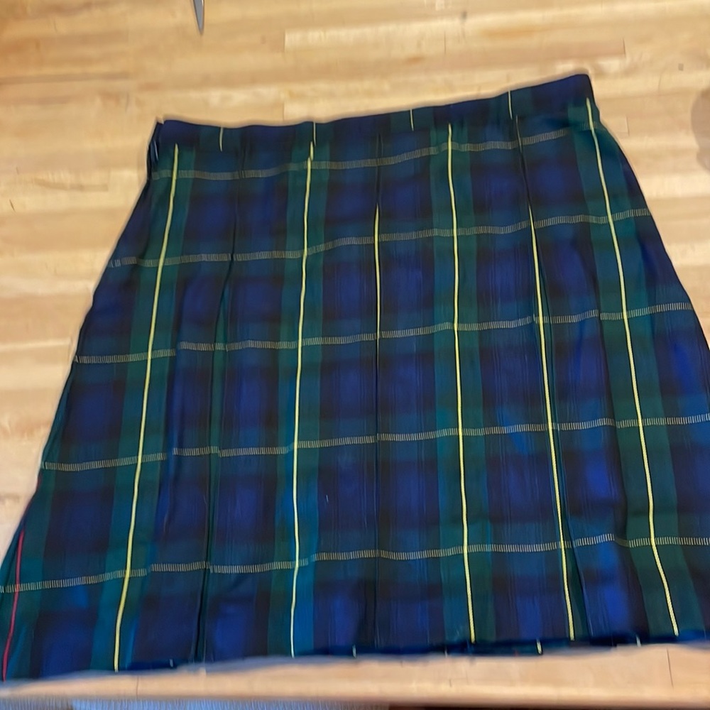 Uniform plait pleated below knee. New. Original packaging.